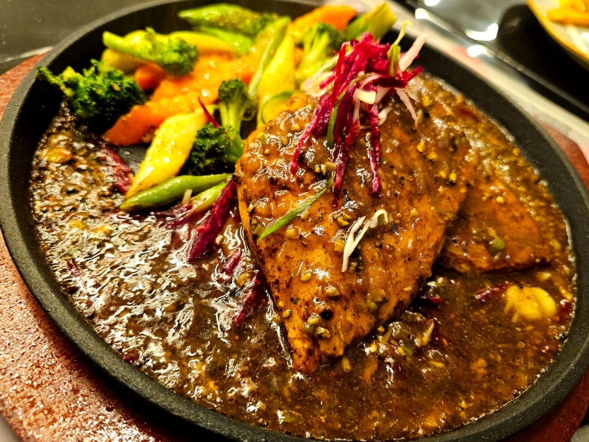 Hand-cut grilled steak plated at Cock 'N' Bull, an Al Majarra, Sharjah restaurant serving signature Pakistani shawarma, smash burgers, grilled steaks, Schezwan chicken and Pakistani-Chinese plates for diners across Sharjah and Dubai