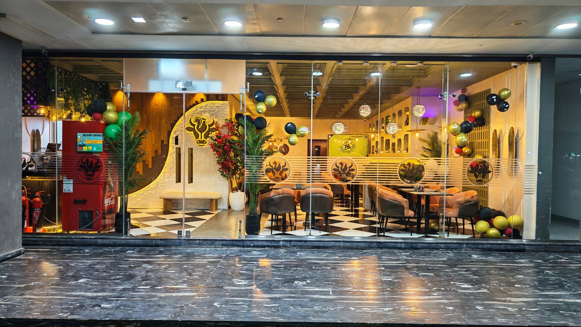 Cock "N" Bull Dubai storefront at Arabian Gate, Silicon Oasis, with the brand logo above the glass entrance